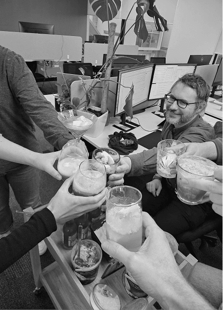 Appetise team raising drinks together in the office